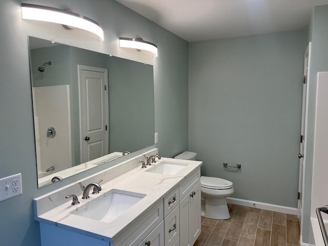 full bathroom featuring vanity, shower / bathtub combination, and toilet