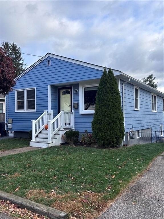 view of front of home with a front yard