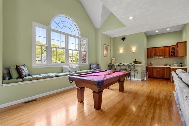 6 Bishop Ln, Middleton, MA 01949 - game room featuring wet bar, billiards, light wood-style floors, baseboards, and high vaulted ceiling