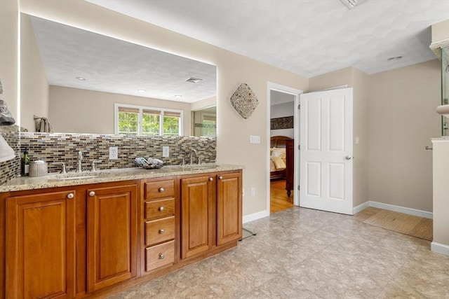 6 Bishop Ln, Middleton, MA 01949 - ensuite bathroom featuring baseboards, tasteful backsplash, and double vanity