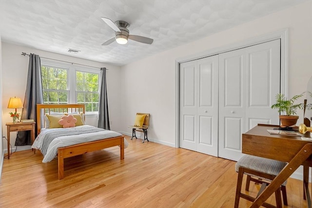 6 Bishop Ln, Middleton, MA 01949 - bedroom featuring a closet, light wood-style flooring, baseboards, and a ceiling fan