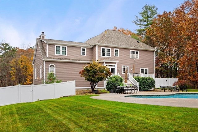 6 Bishop Ln, Middleton, MA 01949 - back of property with a chimney and a patio