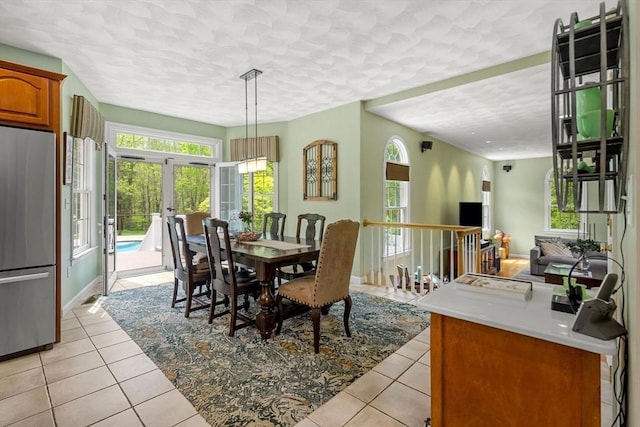 6 Bishop Ln, Middleton, MA 01949 - dining space with light tile patterned flooring, healthy amount of natural light, a textured ceiling, and french doors
