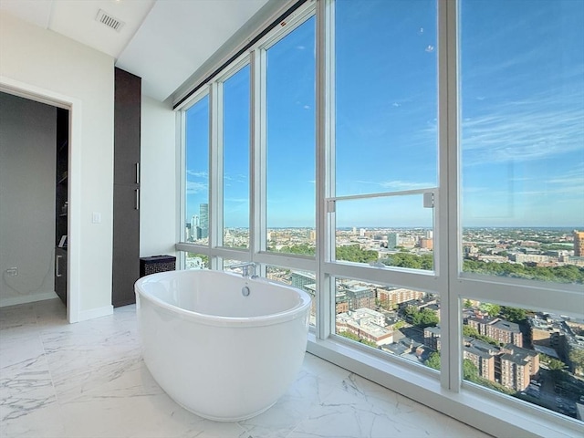 188 Brookline Ave Unit Ph29A, Boston, MA 02215 - full bathroom featuring a view of city, marble finish floors, a soaking tub, and baseboards