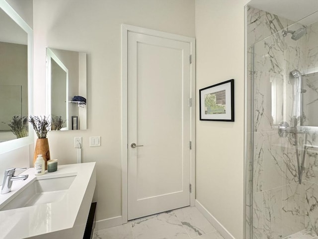 188 Brookline Ave Unit Ph29A, Boston, MA 02215 - bathroom featuring baseboards, marble finish flooring, a marble finish shower, and vanity