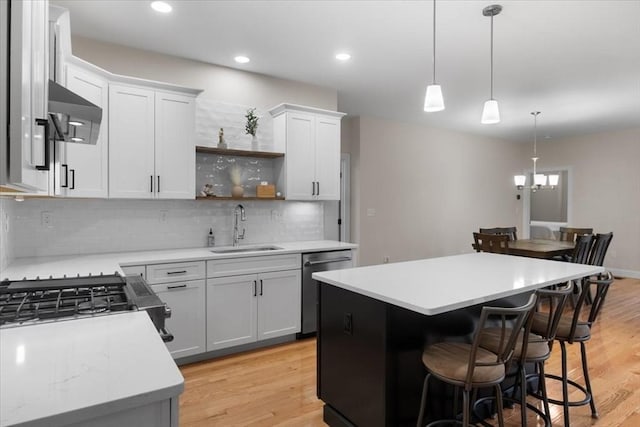 27 Sophia Dr, Rehoboth, MA 02769 - kitchen featuring a sink, dishwasher, ventilation hood, a breakfast bar, and light countertops