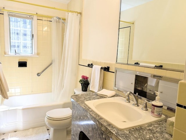 full bathroom featuring tile walls, vanity, shower / bathtub combination with curtain, and toilet