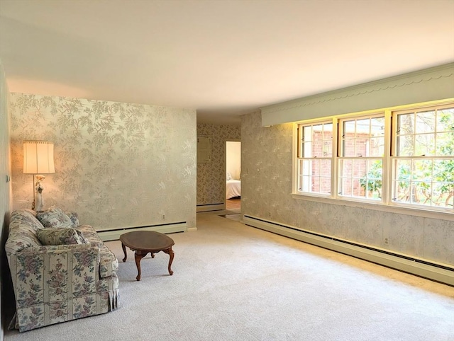 sitting room with a baseboard radiator, carpet floors, and wallpapered walls
