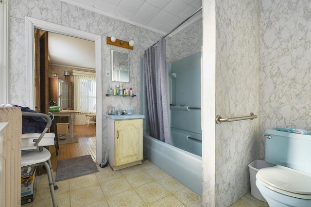 full bathroom featuring shower / tub combo, vanity, crown molding, and toilet