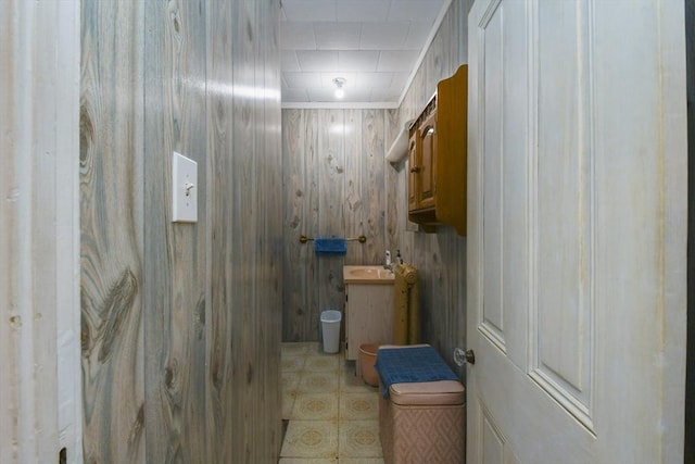 bathroom featuring vanity and ornamental molding