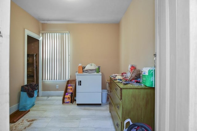 clothes washing area with washer / dryer