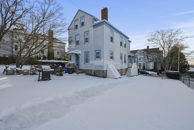 view of snow covered house