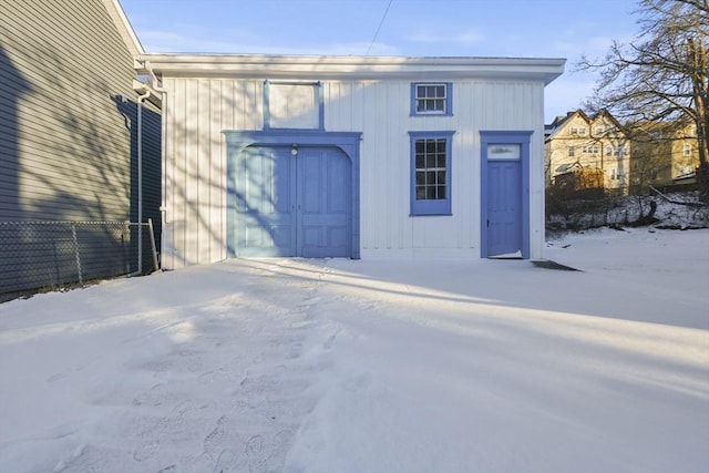 view of snow covered garage