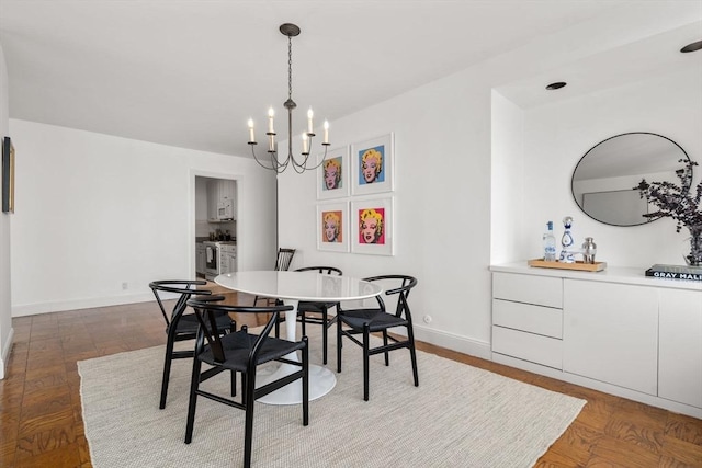 65 E India Unit 27F, Boston, MA 02110 - dining space with a chandelier and baseboards