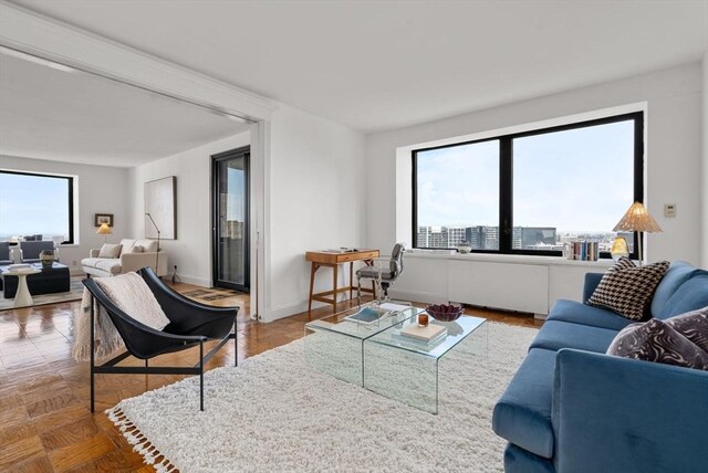 65 E India Unit 27F, Boston, MA 02110 - living room featuring baseboards
