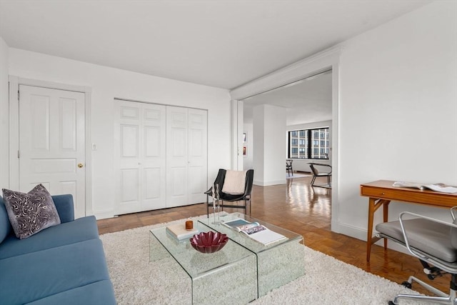 65 E India Unit 27F, Boston, MA 02110 - living room featuring baseboards