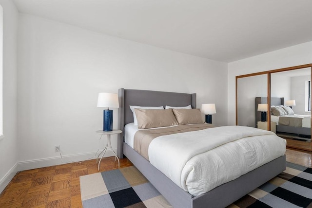 65 E India Unit 27F, Boston, MA 02110 - bedroom featuring baseboards and a closet