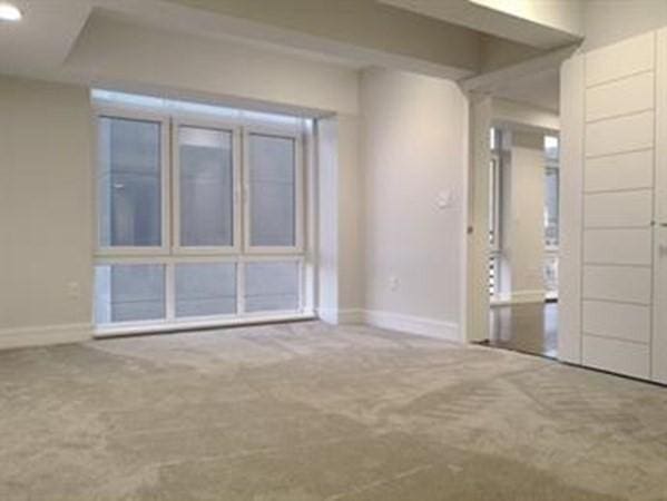 262 Monsignor Obrien Hwy Unit 503, Cambridge, MA 02141 - carpeted empty room with baseboards
