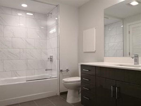 262 Monsignor Obrien Hwy Unit 503, Cambridge, MA 02141 - full bathroom featuring vanity, tile patterned floors, shower / washtub combination, and recessed lighting