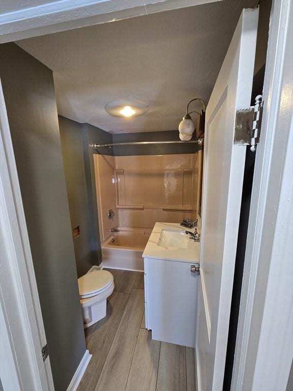 full bathroom featuring shower / tub combination, vanity, and toilet