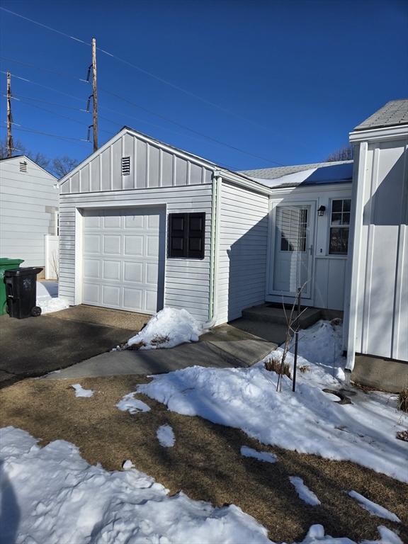 view of snow covered garage