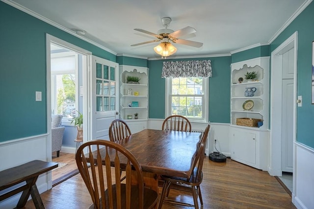 242 Furnace Brook Pkwy, Quincy, MA 02169 - dining space featuring dark wood-style floors, ceiling fan, and crown molding