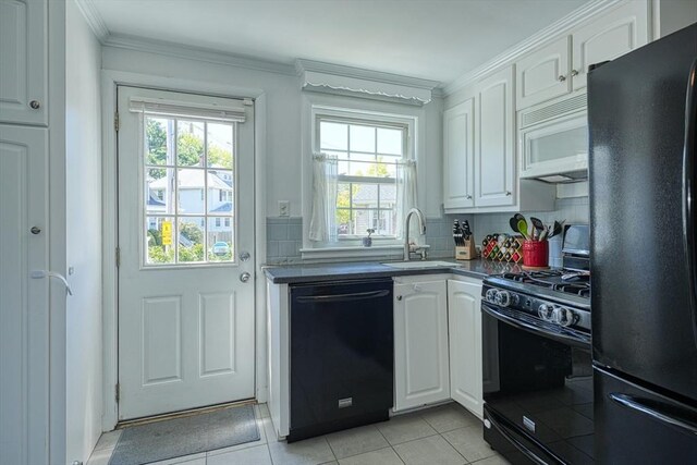 242 Furnace Brook Pkwy, Quincy, MA 02169 - kitchen with black appliances, a sink, white cabinets, healthy amount of natural light, and ornamental molding