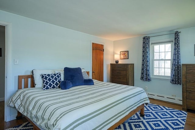242 Furnace Brook Pkwy, Quincy, MA 02169 - bedroom with baseboard heating, wood finished floors, and baseboards