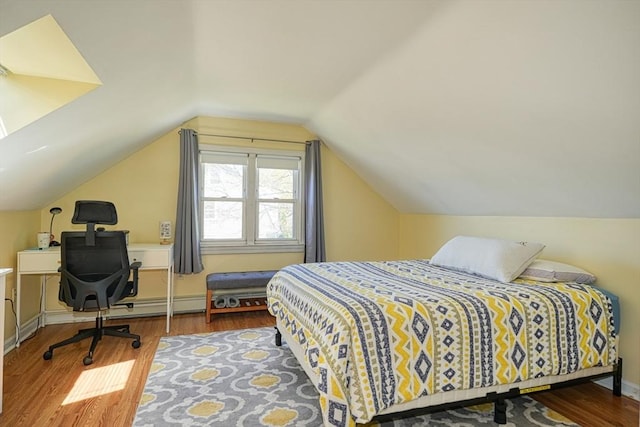 242 Furnace Brook Pkwy, Quincy, MA 02169 - bedroom featuring wood finished floors, lofted ceiling, and baseboards