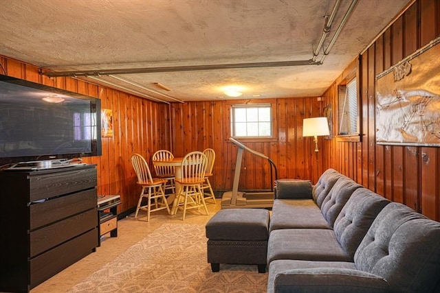 242 Furnace Brook Pkwy, Quincy, MA 02169 - living area featuring wood walls and light colored carpet