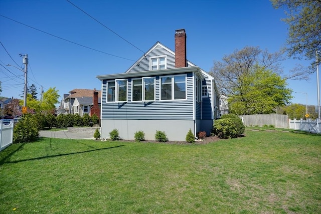 242 Furnace Brook Pkwy, Quincy, MA 02169 - rear view of property with a chimney