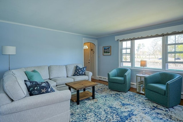 242 Furnace Brook Pkwy, Quincy, MA 02169 - living room with a baseboard heating unit, healthy amount of natural light, wood finished floors, and ornamental molding