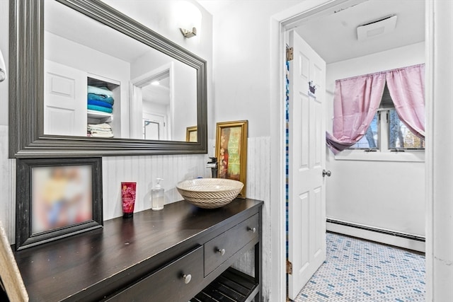 bathroom with tile patterned flooring, vanity, and a baseboard radiator