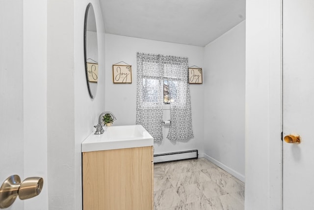 bathroom featuring vanity and baseboard heating