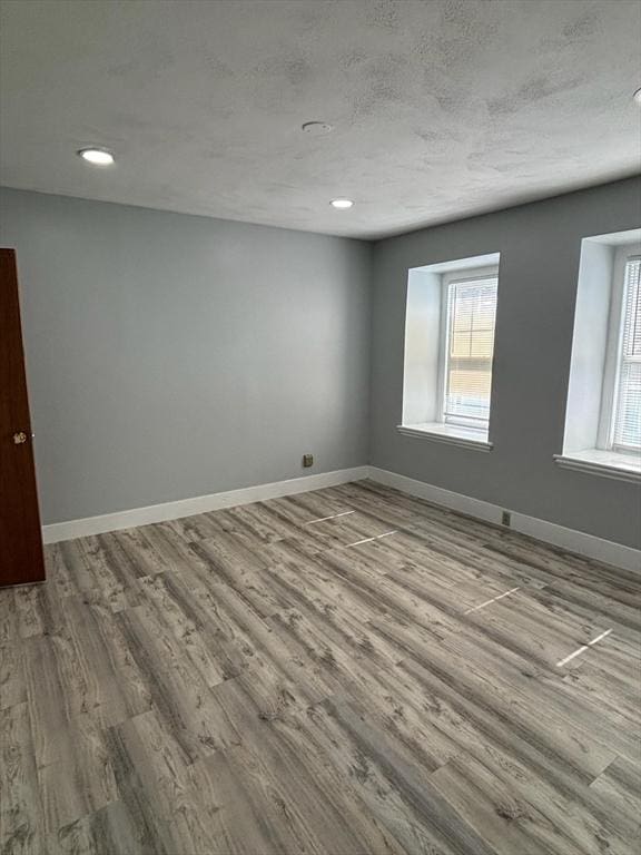 unfurnished room featuring light hardwood / wood-style floors