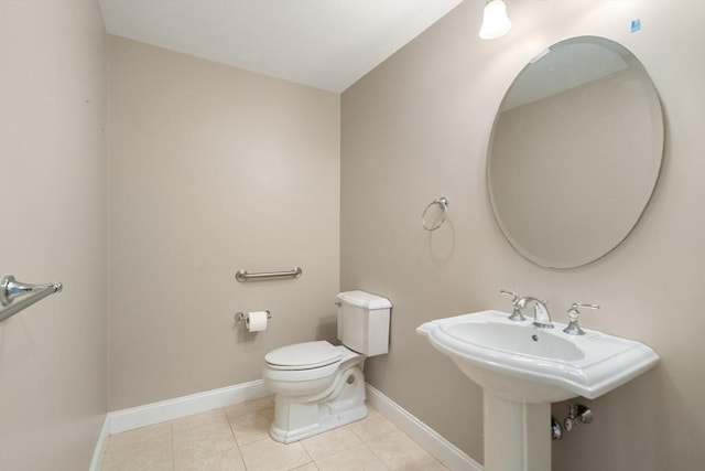 bathroom featuring tile patterned flooring and toilet