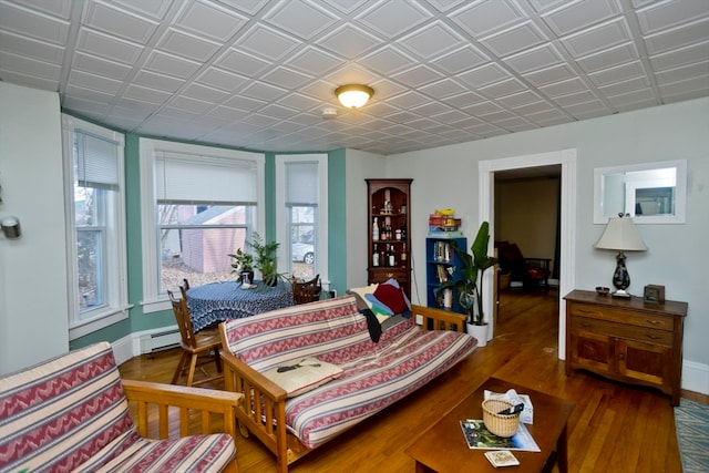 bedroom featuring a baseboard radiator and dark wood-type flooring