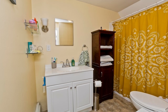 bathroom with vanity, toilet, and baseboard heating