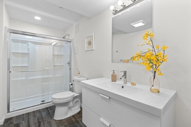 5 Redwood Path Unit 5, Hopkinton, MA 01748 - bathroom featuring vanity, a stall shower, wood finished floors, and toilet