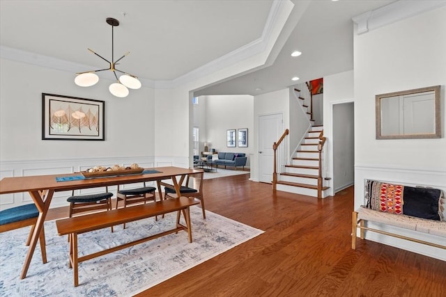 5 Redwood Path Unit 5, Hopkinton, MA 01748 - dining space featuring ornamental molding, stairs, a chandelier, wood finished floors, and a wainscoted wall
