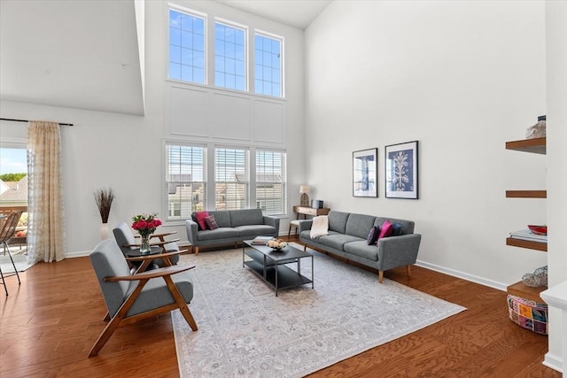 5 Redwood Path Unit 5, Hopkinton, MA 01748 - living area featuring a towering ceiling, wood finished floors, and baseboards