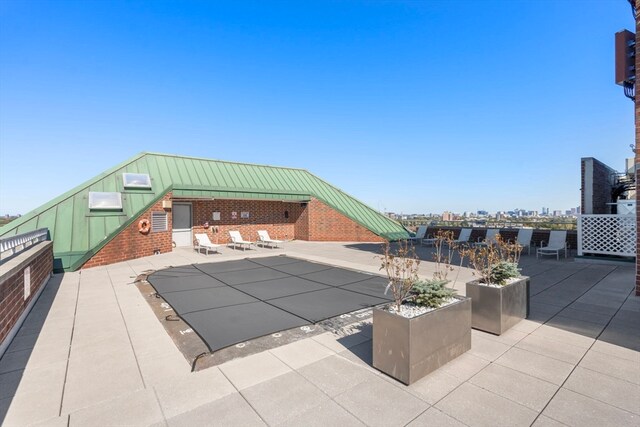 view of pool featuring a patio