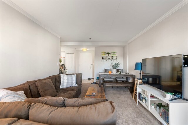 carpeted living room with ornamental molding