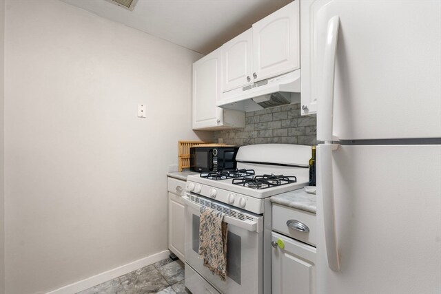 kitchen featuring white cabinets and white appliances