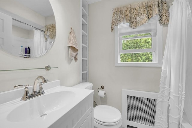 16 Highland Ave, Holden, MA 01520 - bathroom with radiator heating unit, toilet, vanity, and a shower with shower curtain