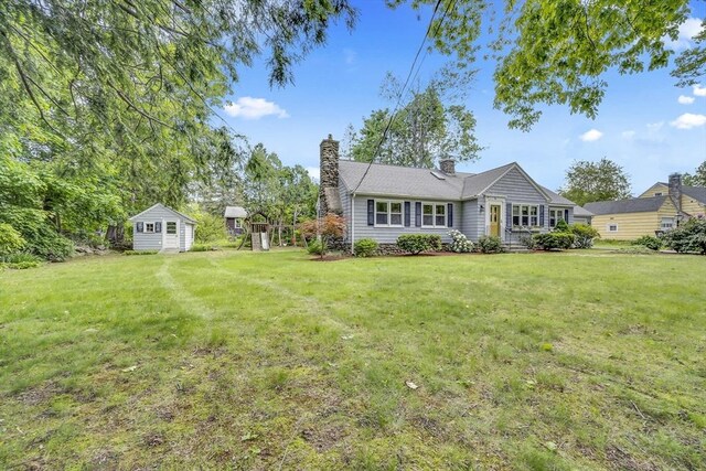 16 Highland Ave, Holden, MA 01520 - view of front of home with a chimney and a front lawn