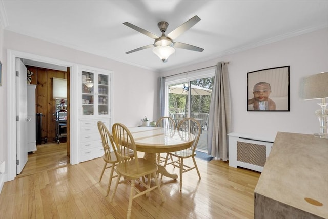 16 Highland Ave, Holden, MA 01520 - dining room with radiator, light wood-type flooring, ceiling fan, and ornamental molding