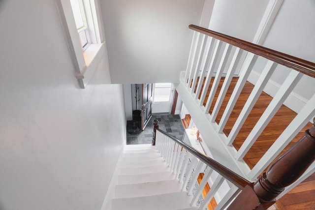 staircase featuring baseboards