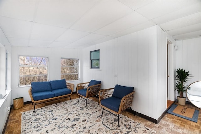 sitting room featuring a paneled ceiling