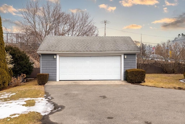 detached garage with fence